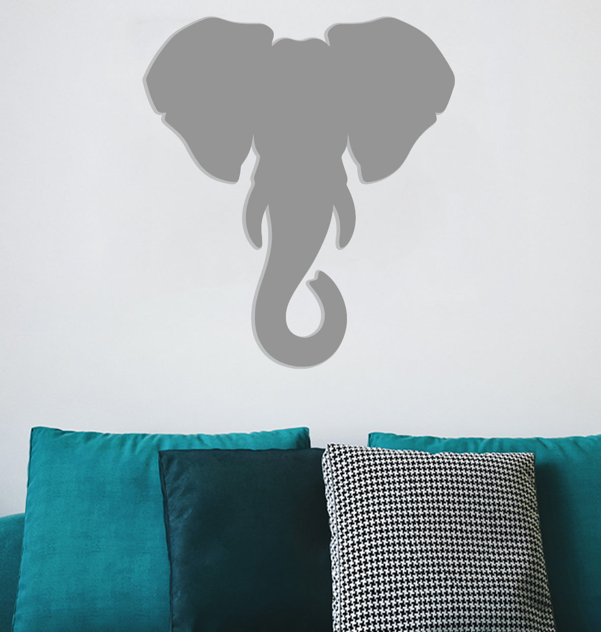 a shadow of an elephant on a wall