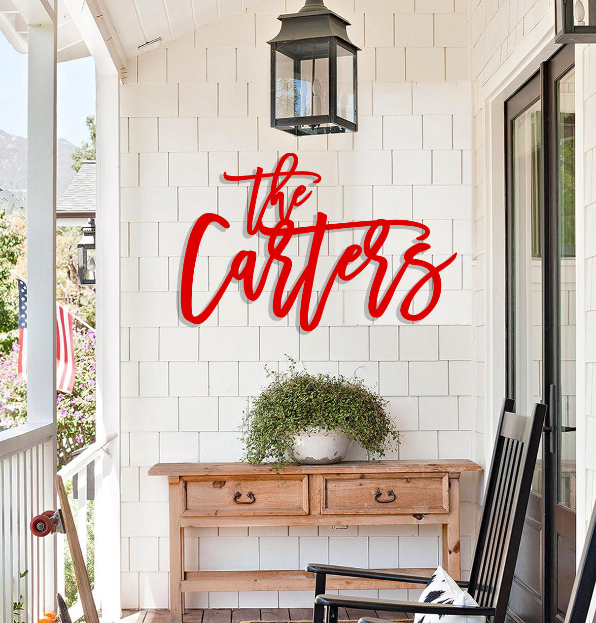 a porch with a wooden bench and a sign that says the cottage