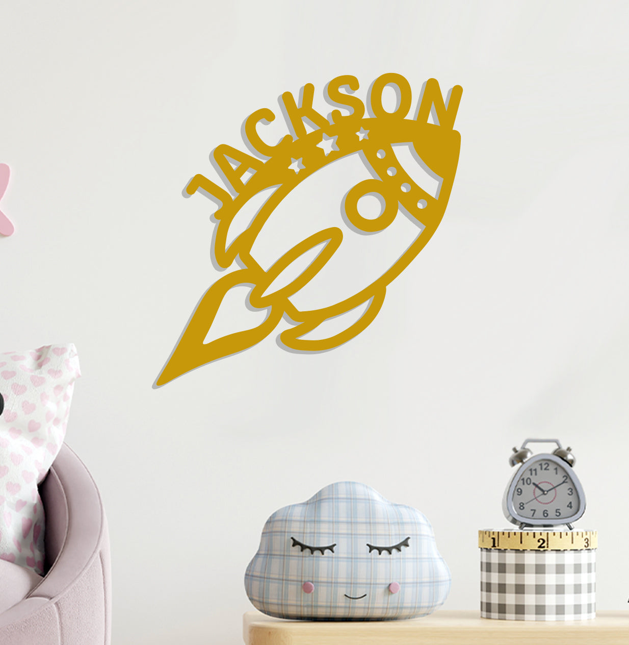 a room with a clock and a wall with a name on it
