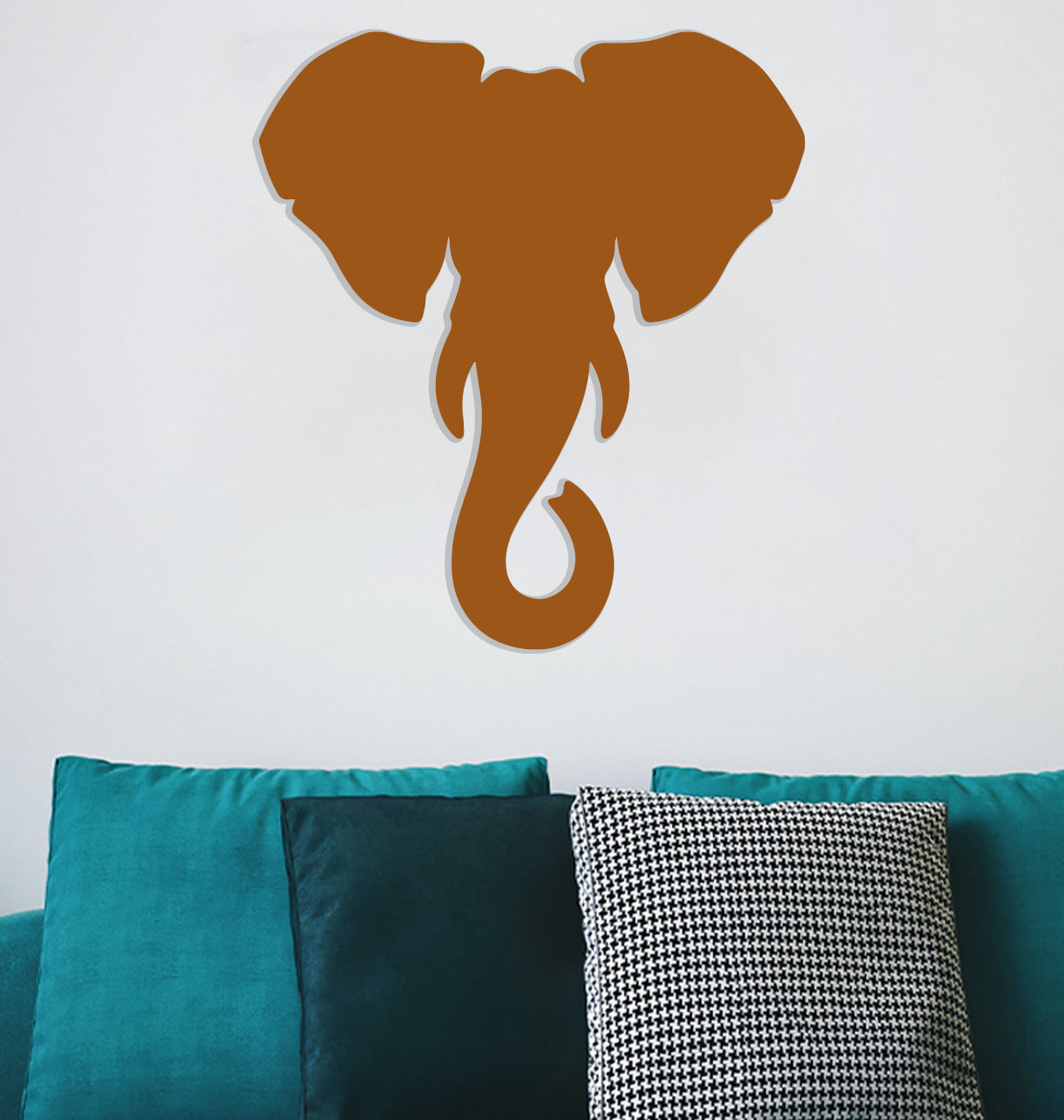 a wall mounted elephant head on a white wall