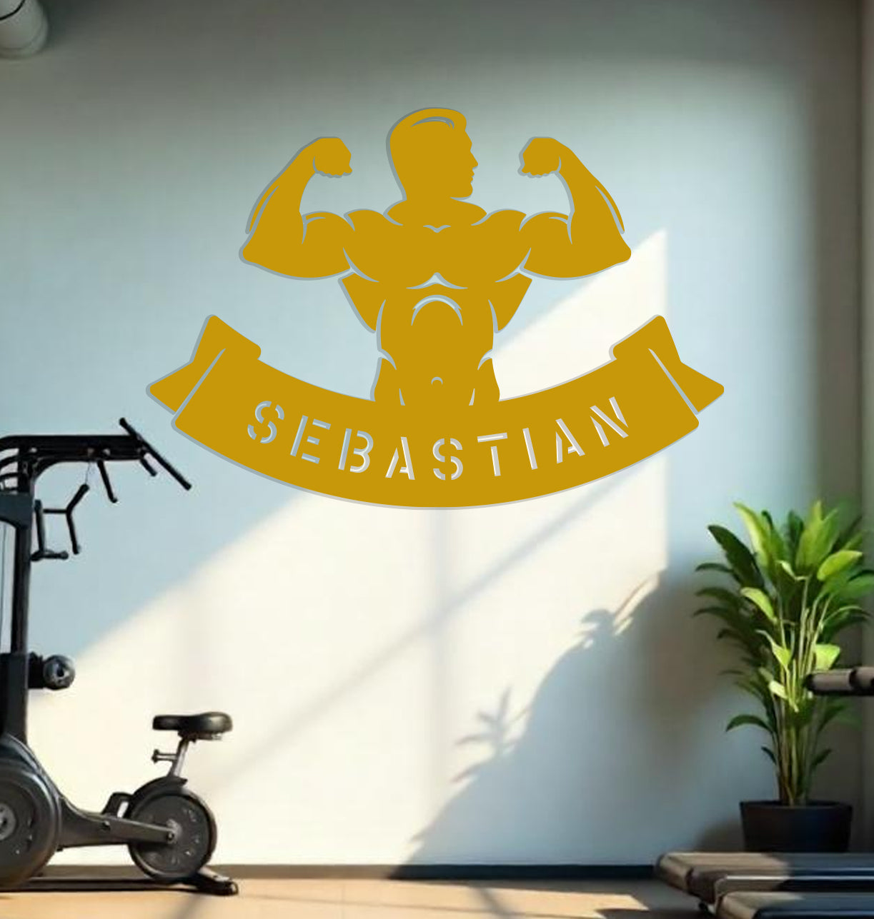 a gym room with a wall decal of a strong man