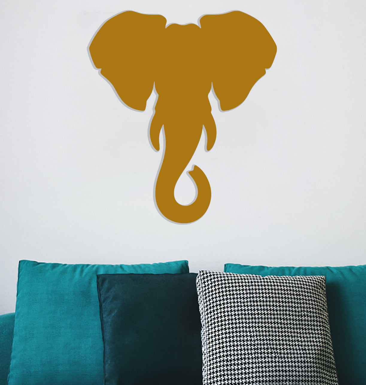 a wall mounted elephant head on a white wall