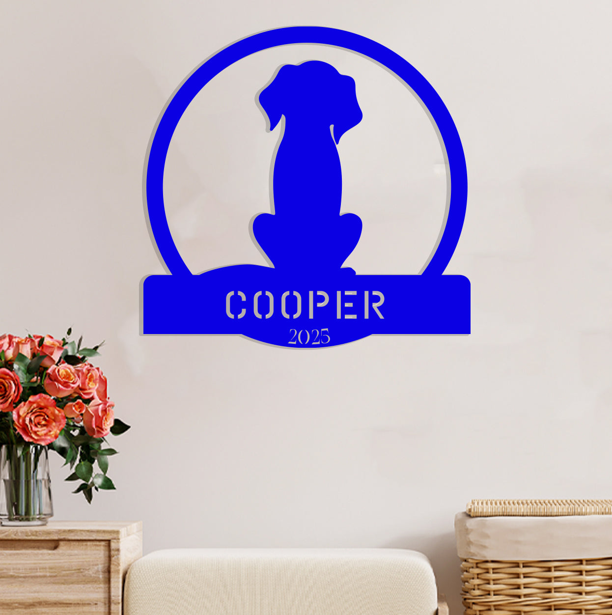 a dog is sitting in a room with a name sign