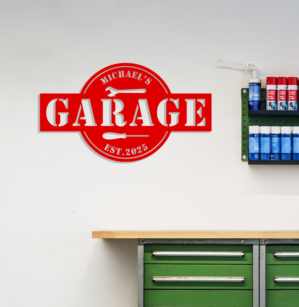 a garage sign mounted to the side of a wall