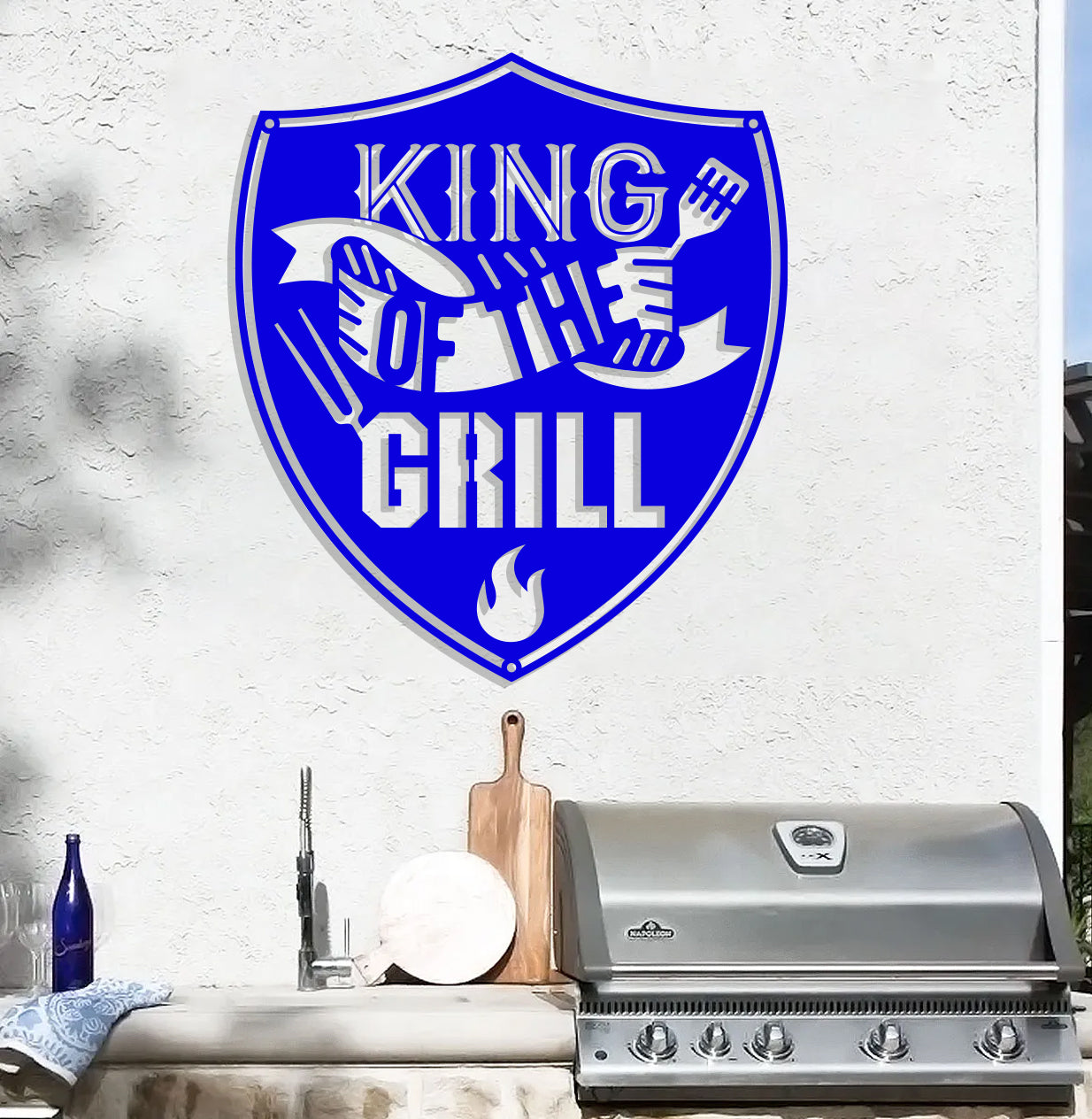 a grill with a sign that says king of the grill