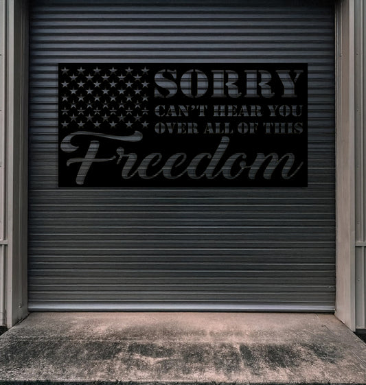 a garage door with a sign that says sorry can't hear you over me