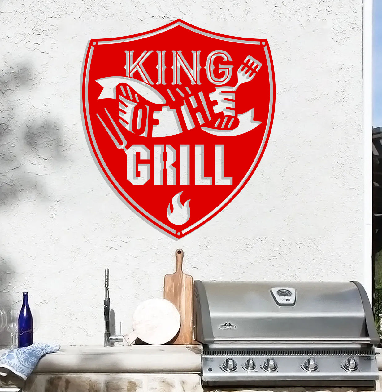 a grill with a sign that says king of the grill