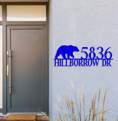 a blue sign that reads 350 hillbrorow dr with a bear on it