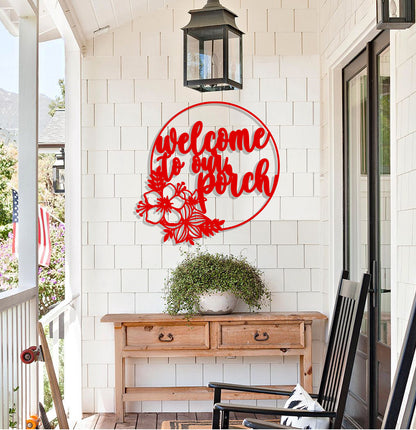 a welcome sign on the front porch of a house