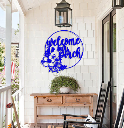 a welcome sign on the front porch of a house