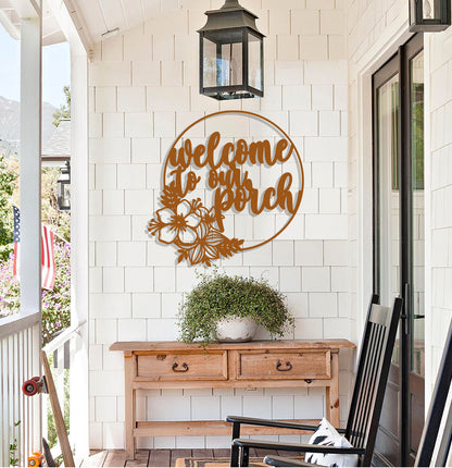 a welcome sign on the front porch of a house
