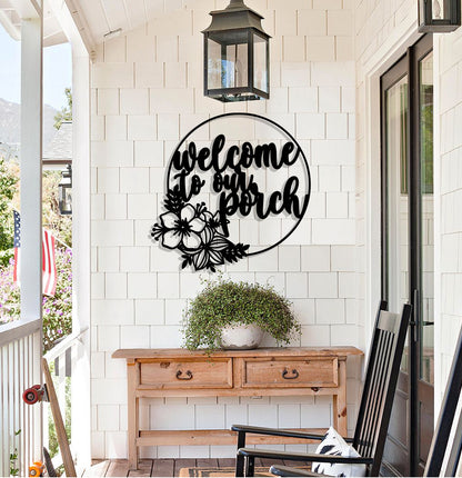 a welcome sign on the front porch of a house