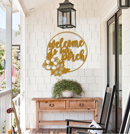 a welcome sign on the front porch of a house