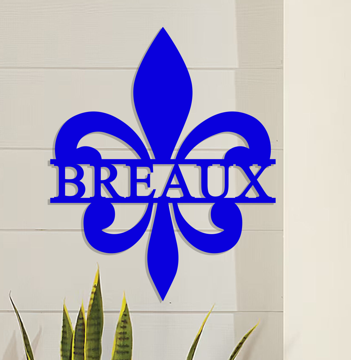 a blue sign that says breaux next to a potted plant