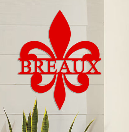 a red metal sign that says breaux next to a potted plant