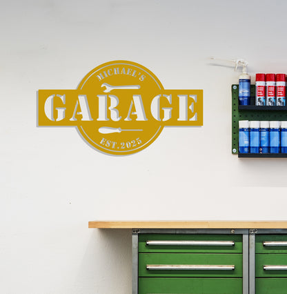 a garage sign mounted to the side of a wall