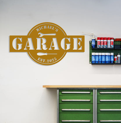 a garage sign on the wall above a green cabinet