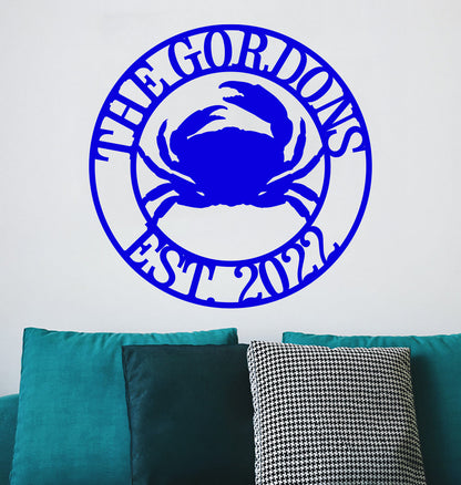 a blue crab sitting on top of a green couch