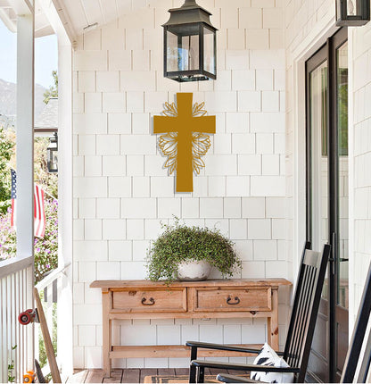 a cross on the wall of a porch