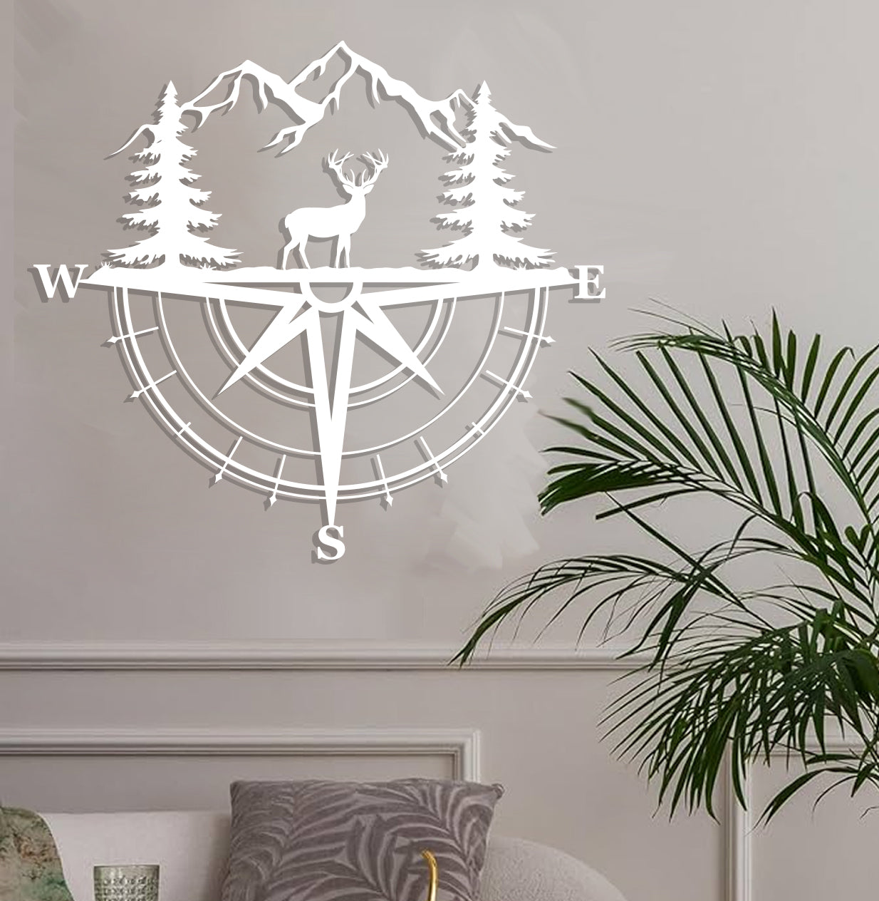 a white wall with a compass and trees on it