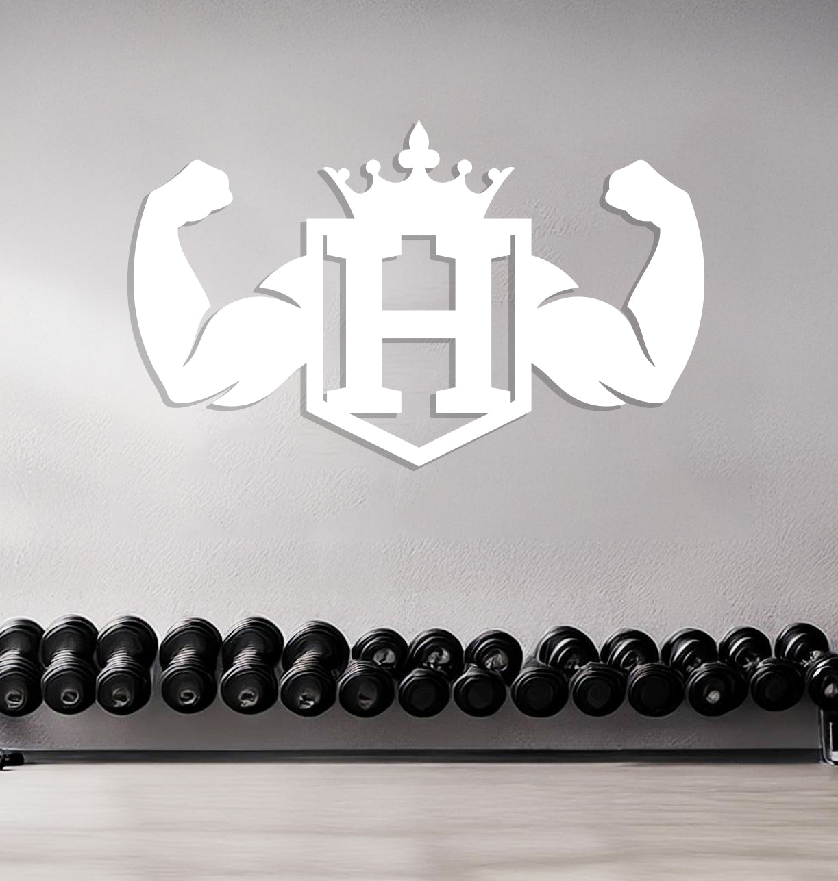 a wall with a crown and dumbbells in front of it