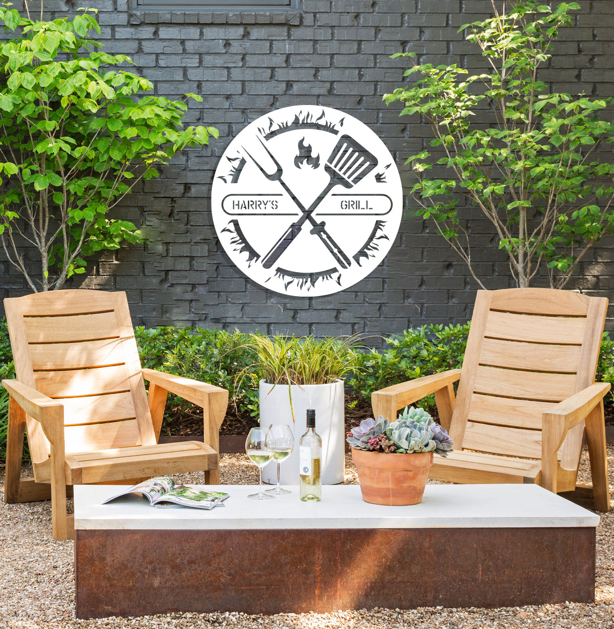 a couple of chairs sitting in front of a brick wall